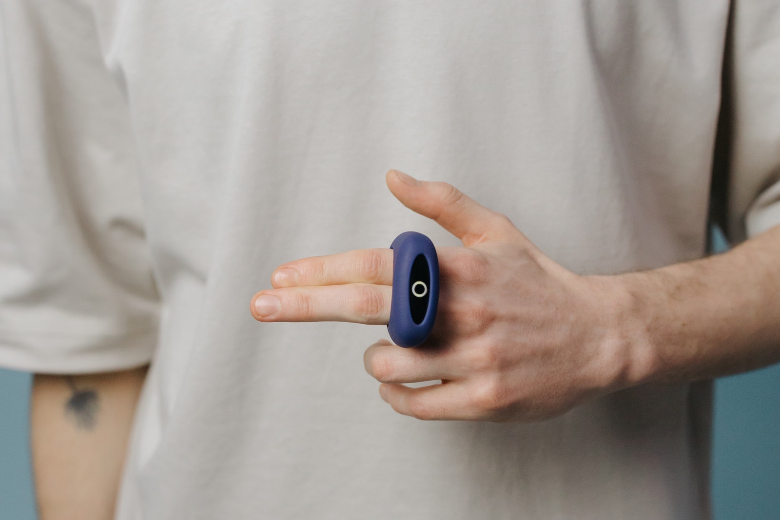 Person Holding Blue and Black Device