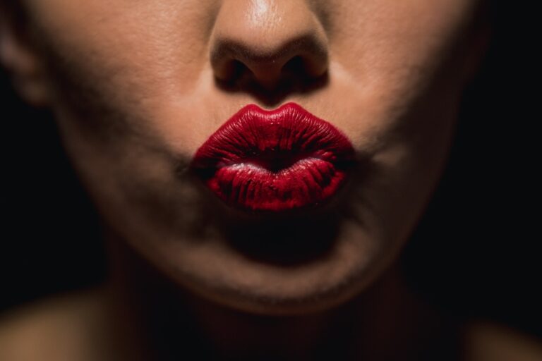 woman with red lipstick and black mascara