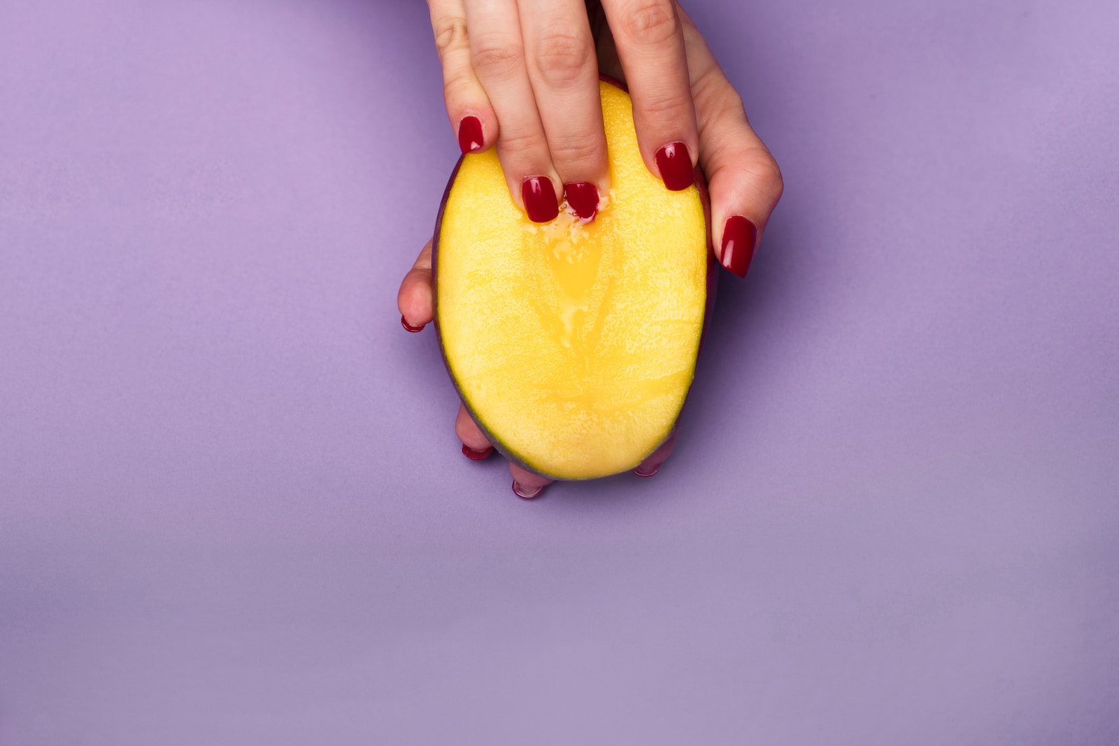 person holding sliced of watermelon